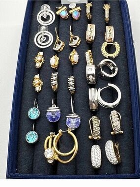 14 pairs of earrings. Gold tone and silver. Beautiful and elegant.